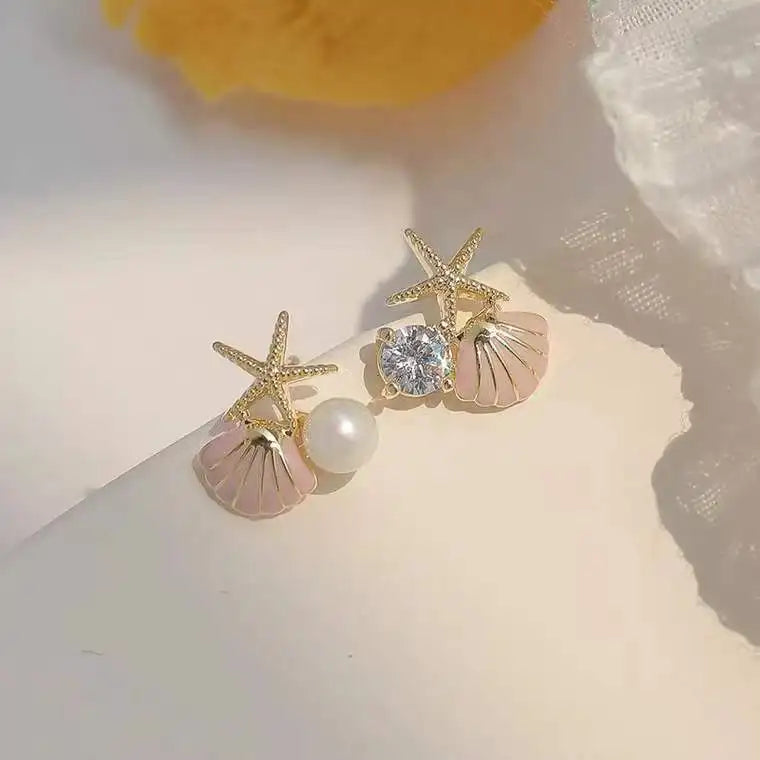 Pendientes de Clavo con Conchas y Perla
